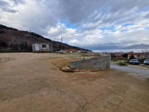 a brick wall sitting on the side of a road at APARTMENT NUNA in Baška