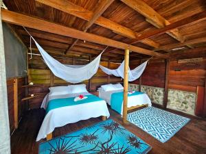 Ένα ή περισσότερα κρεβάτια σε δωμάτιο στο Hotel Piedra Piedra Lodge