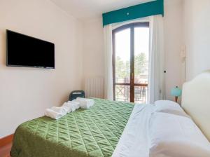 Säng eller sängar i ett rum på Villa Serra Alta