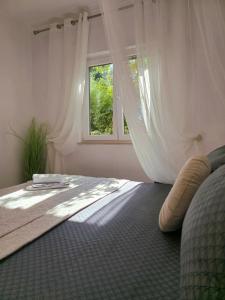Posteľ alebo postele v izbe v ubytovaní Elite Residence Flos