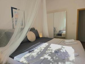 Posteľ alebo postele v izbe v ubytovaní Elite Residence Flos
