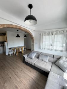 a living room with a couch and a table at La Costera in Barrio-Mar