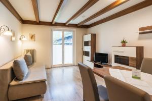 TV a/nebo společenská místnost v ubytování Appartementanlage Thermenblick SKI IN & SKI OUT