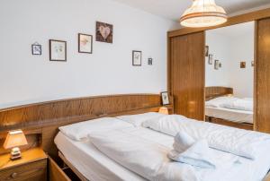 Postel nebo postele na pokoji v ubytování Appartementanlage Thermenblick SKI IN & SKI OUT