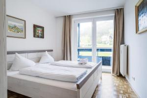 A bed or beds in a room at Appartementanlage Thermenblick SKI IN & SKI OUT Még 37 kép