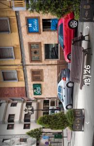 a car parked in front of a building at Hostal Goias in Oviedo