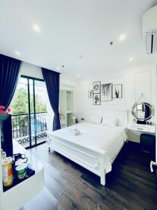 Ein Bett oder Betten in einem Zimmer der Unterkunft Amy Hotel & Apart' Hue