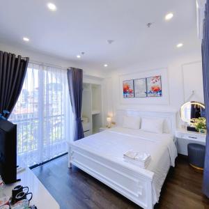 Ein Bett oder Betten in einem Zimmer der Unterkunft Amy Hotel & Apart' Hue