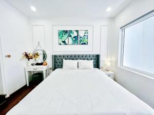 Ein Bett oder Betten in einem Zimmer der Unterkunft Amy Hotel & Apart' Hue