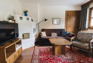 Telewizja i/lub zestaw kina domowego w obiekcie Appartements Pulverer
