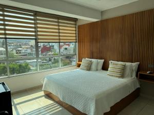 Postel nebo postele na pokoji v ubytování Hotel DABA