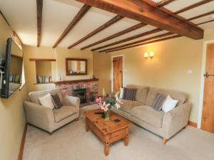 Χώρος καθιστικού στο Tillers Cottage