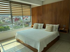 Postel nebo postele na pokoji v ubytování Hotel DABA