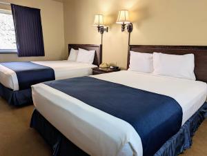 Postel nebo postele na pokoji v ubytování First Gold Gaming Resort