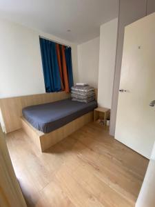 a small bedroom with a bed and a window at Not Very Quiet But Best location in London