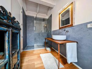 a bathroom with a sink and a mirror at La Casa di Marina in Muro Leccese +36 photos
