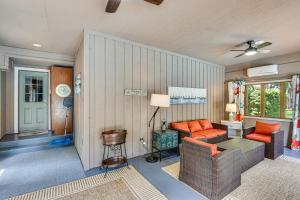 a living room with a couch and a table at Cassopolis Vacation Home - Walk to Diamond Lake! in Cassopolis