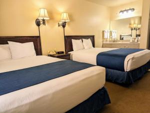 Postel nebo postele na pokoji v ubytování First Gold Gaming Resort