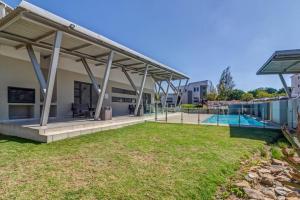 an image of a villa with a swimming pool at Modern Fourways 3-Bed Loft - Backup Power in Sandton