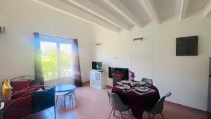 a living room with a table and a couch at La villa De Lina 637 -Self Check In - in Gallargues-Le-Montueux