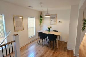 a dining room with a table and chairs at Boho Bliss - 1Br, 1Bath w/Patio! in Chicago