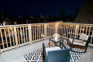 a deck with two chairs and a table on a balcony at Boho Bliss - 1Br, 1Bath w/Patio! in Chicago