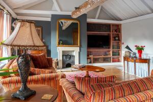 a living room with a couch and a table at Luxury Georgian Townhouse in heart of Norwich Sleeps 4 in Norwich