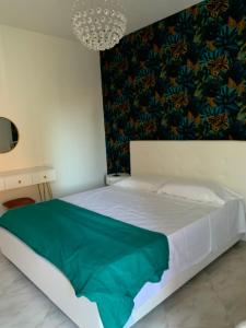 A bed or beds in a room at Casa Ammare