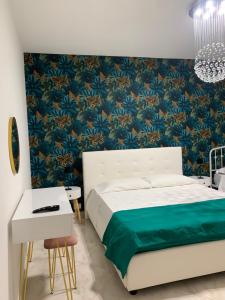 A bed or beds in a room at Casa Ammare