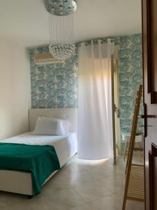 A bed or beds in a room at Casa Ammare