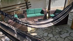 an overhead view of a hammock with chairs and tables at Casita Cumbuco in Cumbuco