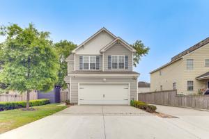 a house with a white garage in a driveway at Modern Virginia Beach Retreat in Resort District! in Virginia Beach