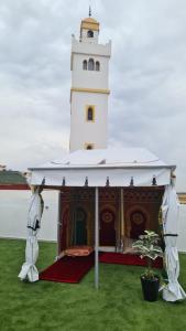 a gazebo in front of a lighthouse at Camping on the rooftop close to Casablanca Airport in Dah Hammou Ben Cheïkh +3 photos