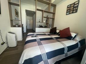 Säng eller sängar i ett rum på Airport Apartment la Aurora Guatemala