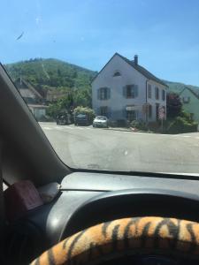 a view of a street from the inside of a car at Les anciens thermes in Soultzbach-les-Bains