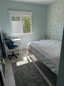 a bedroom with a bed and a desk and a chair at Casa Estrella Gandia in Gandía +36 photos