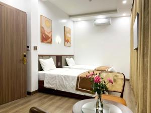 Postel nebo postele na pokoji v ubytování KING HOTEL