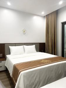 Postel nebo postele na pokoji v ubytování KING HOTEL