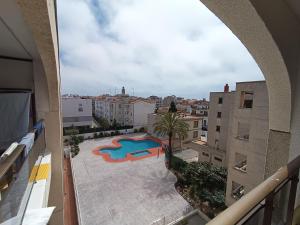 a view of a swimming pool from an apartment balcony at Apartamento nuevo en Calella totalmente reformado con Parking privado in Calella
