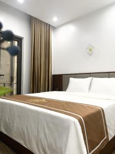 Postel nebo postele na pokoji v ubytování KING HOTEL