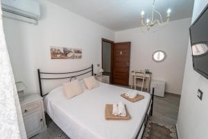 Postel nebo postele na pokoji v ubytování Domo Papiros B&B
