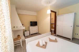 Postel nebo postele na pokoji v ubytování Domo Papiros B&B