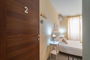 Postel nebo postele na pokoji v ubytování Domo Papiros B&B