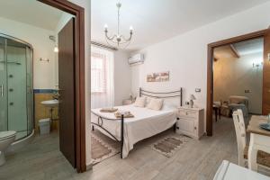 Postel nebo postele na pokoji v ubytování Domo Papiros B&B