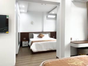 Postel nebo postele na pokoji v ubytování KING HOTEL