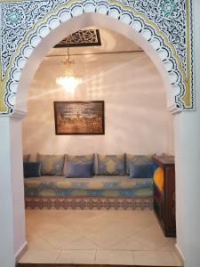 an archway with a couch in a room at Blue City in Chefchaouen