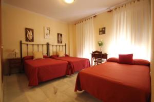 Posteľ alebo postele v izbe v ubytovaní Hostal Niza + 8 fotografií