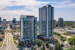 an aerial view of a city with tall buildings at Newly Built Condo w Amazing Amenities and Views in Kitchener