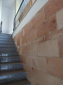 a brick wall and stairs in a building at SteLuRe in Aradeo