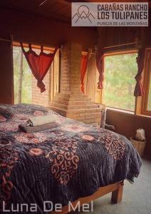 Ένα ή περισσότερα κρεβάτια σε δωμάτιο στο Cabanas Rancho Los Tulipanes - dream of peace